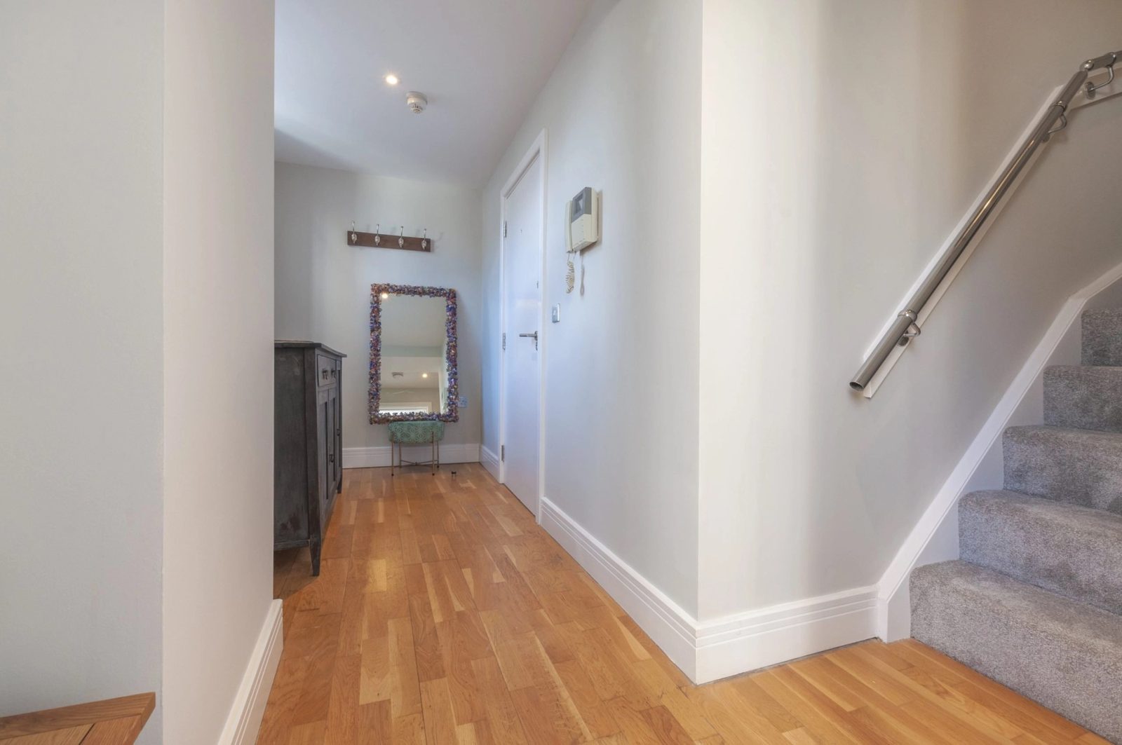 The hallway and stairs between the two floors